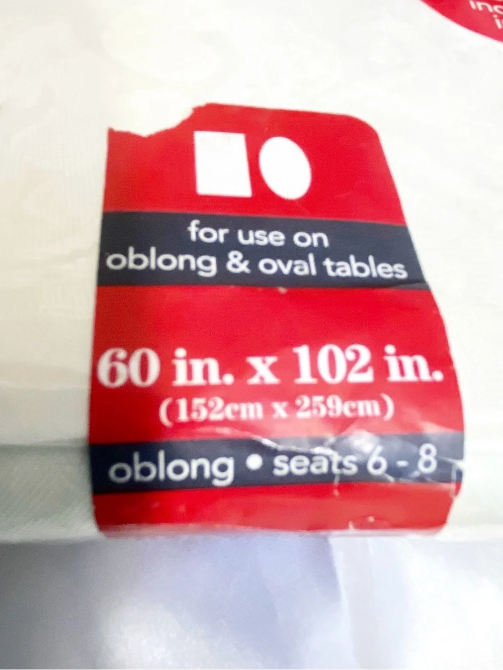 December Home satiny rectangular oblong tablecloth and 8 napkin set 60” x 102”.